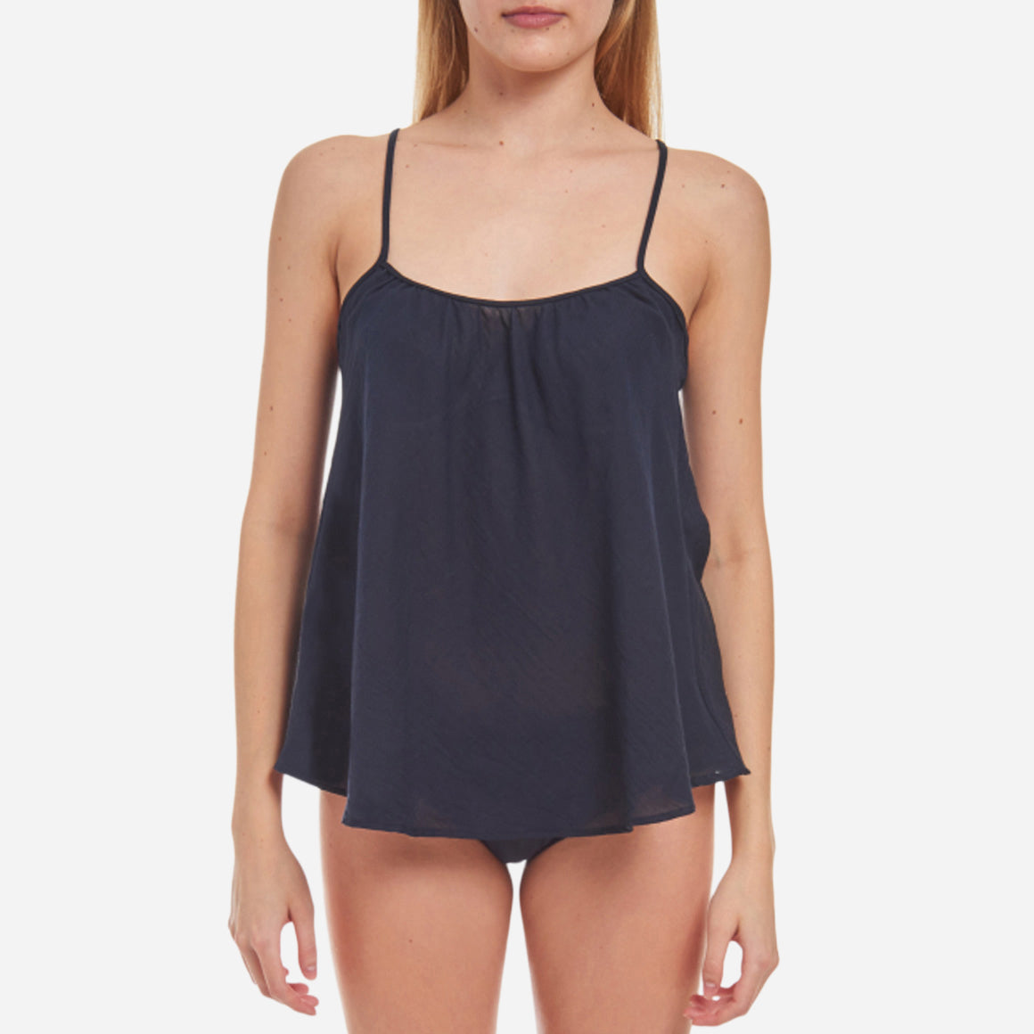 Loup Charmant’s Cotton Scoop Tank is the epitome of sophistication and versatility. Made from the finest quality cotton, this scoop tank offers an unmatched level of softness and elegance. The smooth, breathable fabric caresses your skin, providing a luxurious feel and a flattering drape that accentuates your natural curves. The relaxed fit and timeless design of this pajama top features a classic scoop neckline and delicate straps, offering a perfect balance between style and allure.