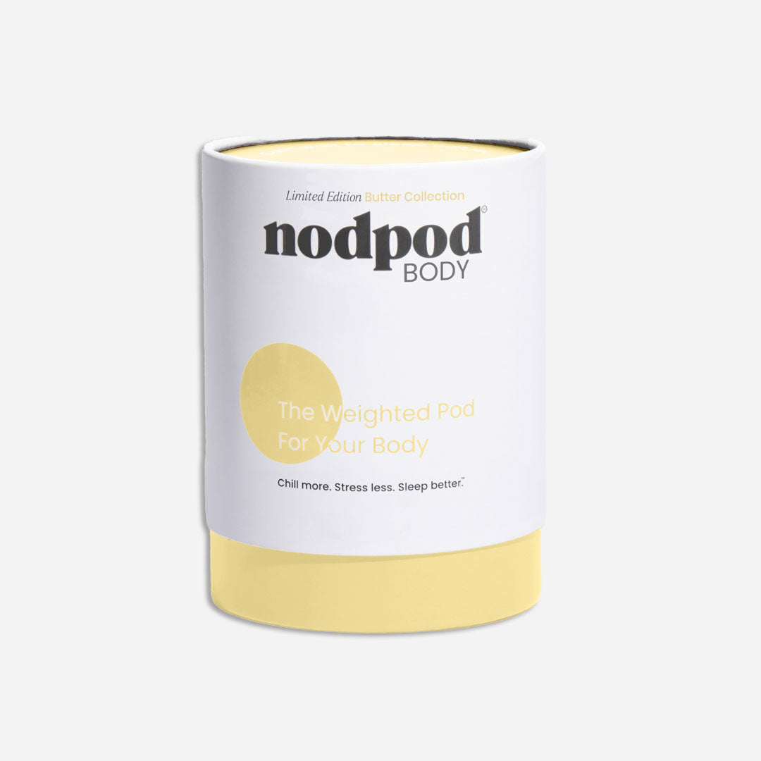 White and yellow weighted pod with 'nodpod BODY' branding on a light grey background