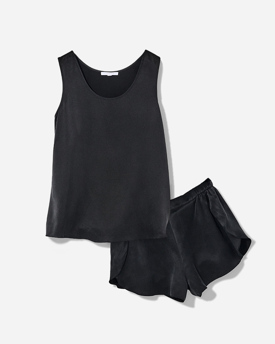 The set includes a sleeveless tee and relaxed-fit shorts, both crafted from breathable silk fabric that is lightweight, comfortable, and machine washable. The shorts feature an elastic waistband for a perfect fit, while the top is designed with a flattering neckline and relaxed fit that drapes beautifully on the body.