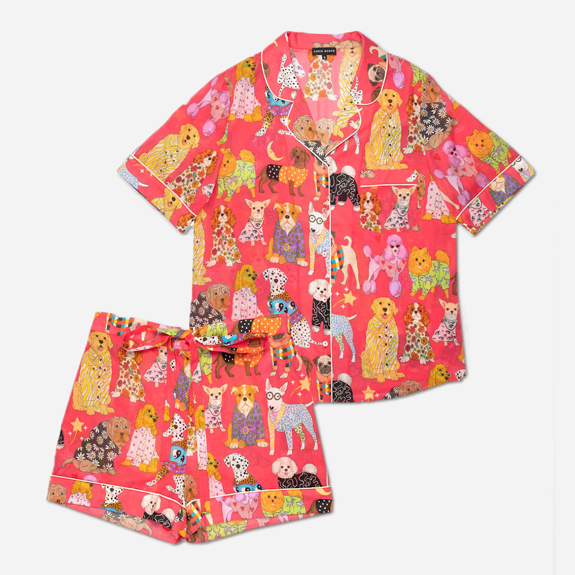 These pajamas feature a tailored fit with short sleeves, making them perfect for warm evenings and mornings spent lounging. The high-quality, soft and breathable cotton fabric feels gentle against your skin and the intricate details and beautiful finishings showcase Karen Mabon’s attention to detail.