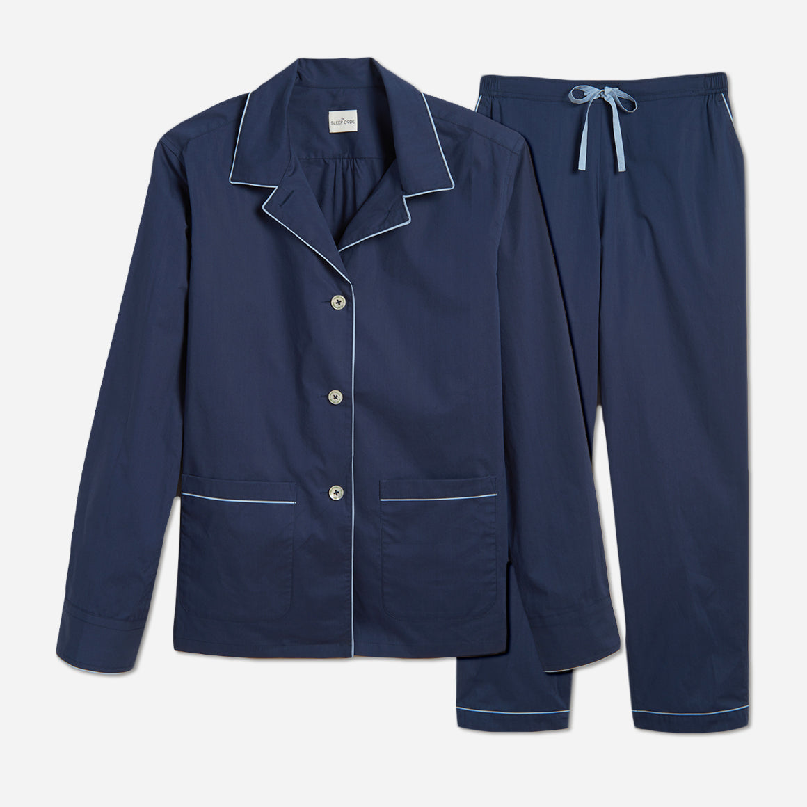 The pajama set includes a classic button-up top with a collar, two patch pockets, and functional button cuffs. The matching pair of pants features a comfortable elastic waistband, drawstring, and side-seam pockets. This cozy pj set is a timeless and stylish look that is perfect for lounging at home.