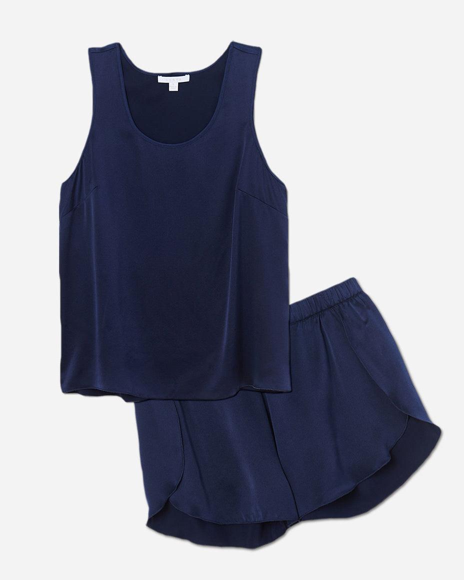The set includes a sleeveless tee and relaxed-fit shorts, both crafted from breathable silk fabric that is lightweight, comfortable, and machine washable. The shorts feature an elastic waistband for a perfect fit, while the top is designed with a flattering neckline and relaxed fit that drapes beautifully on the body.