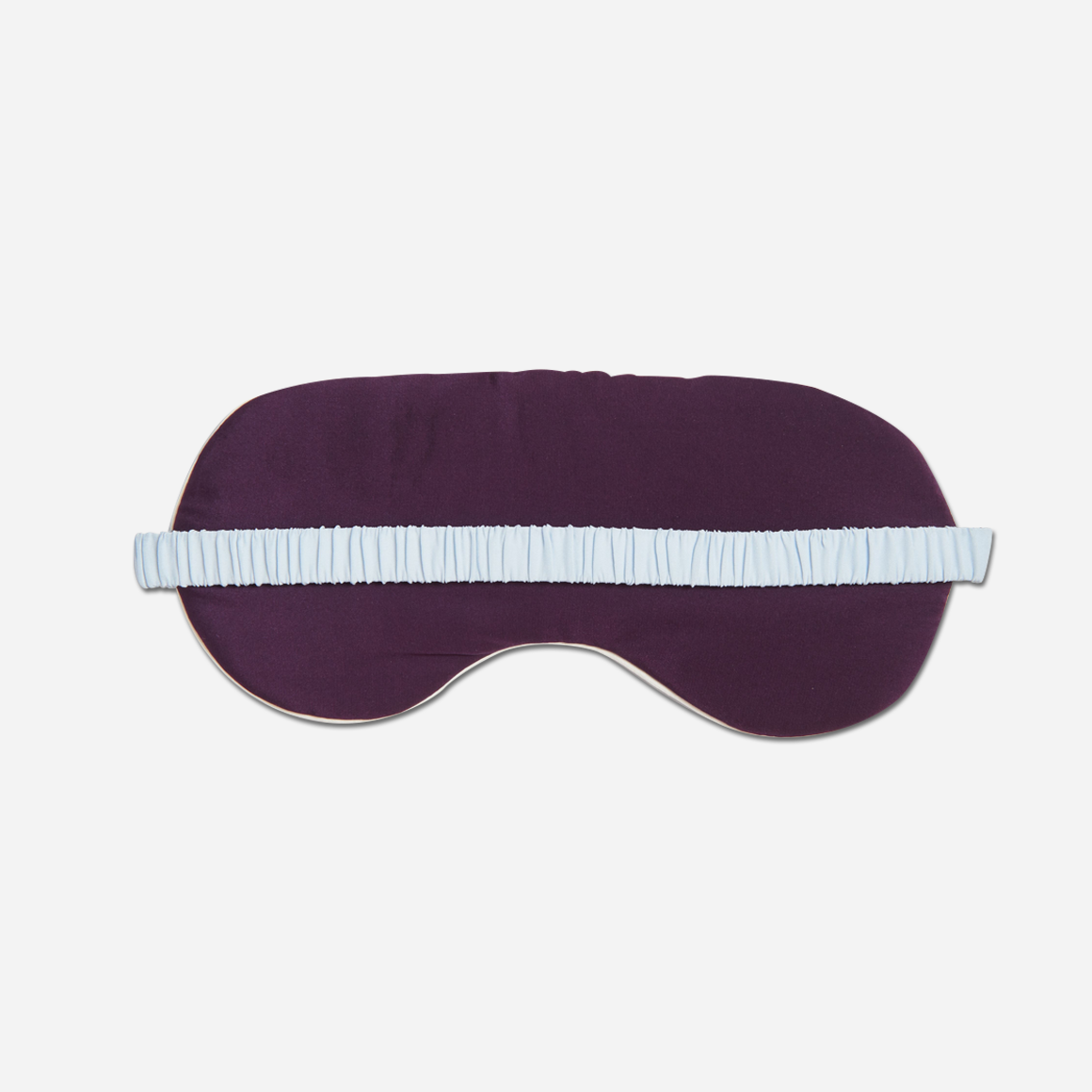 The covered elastic strap ensures a perfect fit for all head sizes, while the gentle padding around the eye area ensures that the mask doesn't put any pressure on your eyes. This reversible sleep mask has a complementary contrast color on the opposite side, and is detailed with stylish piping trim.