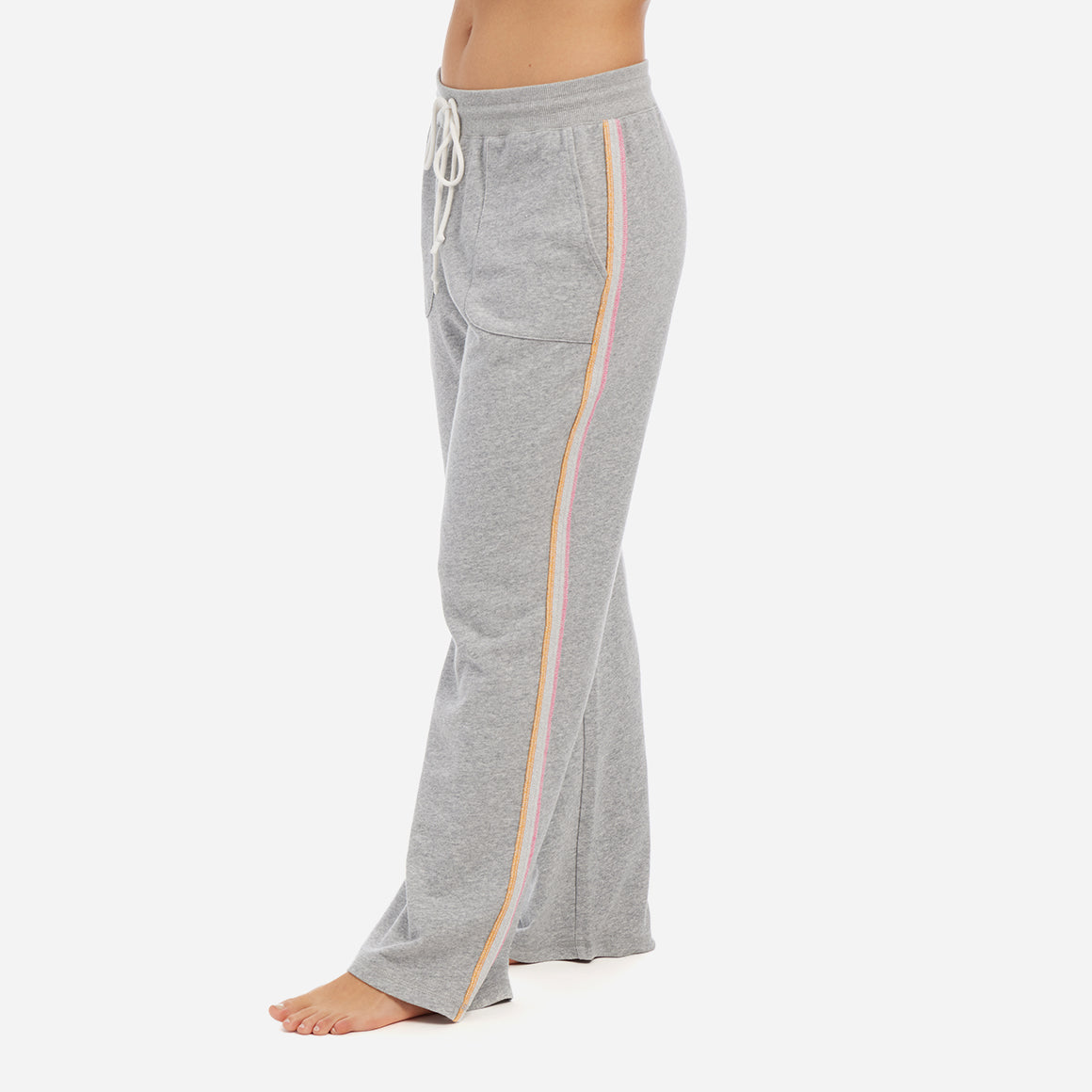These cozy lounge pants feature a relaxed fit and an elastic waistband with an adjustable drawstring to provide a customized and secure fit. The neon stripes along the side seams add a modern pop of color, while the convenient hip pockets will make this your go-to sweatpants.
