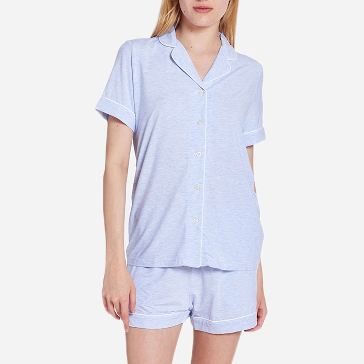 Front-facing model wearing a light blue short sleeve top and bottom pajama set.