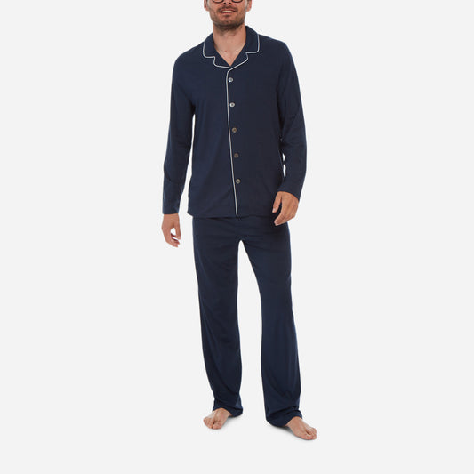 A front-facing model is wearing a long sleeve pajama set made of navy micro modal fabric.