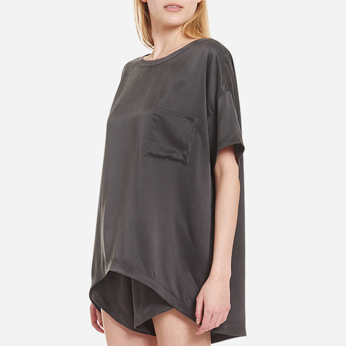 The set includes a short-sleeved tee and relaxed-fit shorts, both crafted from breathable silk fabric that is lightweight, comfortable, and machine washable. The shorts feature an elastic waistband for a perfect fit, while the tee is designed with a flattering neckline, chest pocket, and relaxed fit that drapes beautifully on the body.
