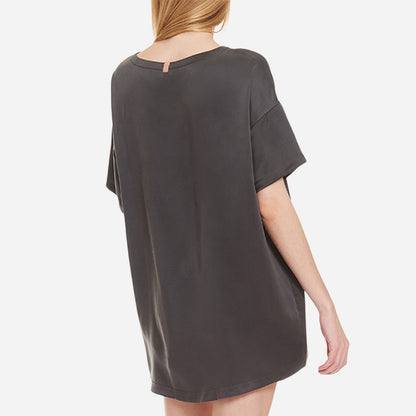 The set includes a short-sleeved tee and relaxed-fit shorts, both crafted from breathable silk fabric that is lightweight, comfortable, and machine washable. The shorts feature an elastic waistband for a perfect fit, while the tee is designed with a flattering neckline, chest pocket, and relaxed fit that drapes beautifully on the body.