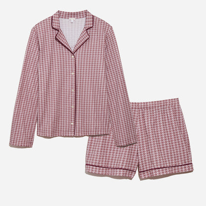 Long sleeve button up top and shorts pajama set against grey background. PJ set has checkered print in wild orchid colorway.