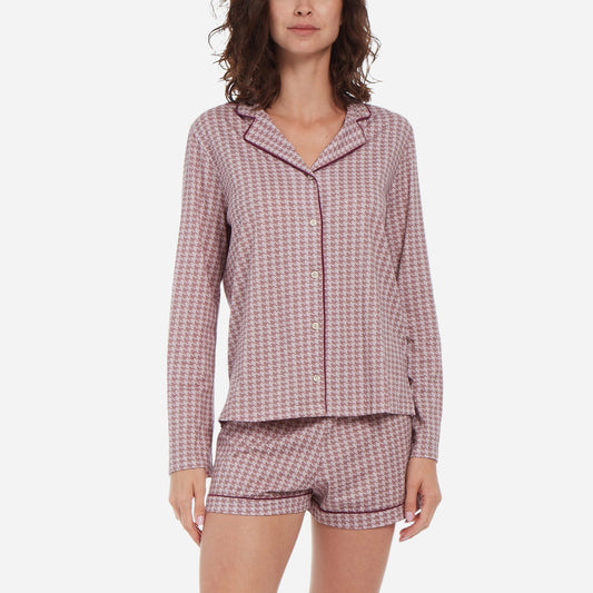 Forward facing model wearing a long sleeve button up top and shorts pajama set.