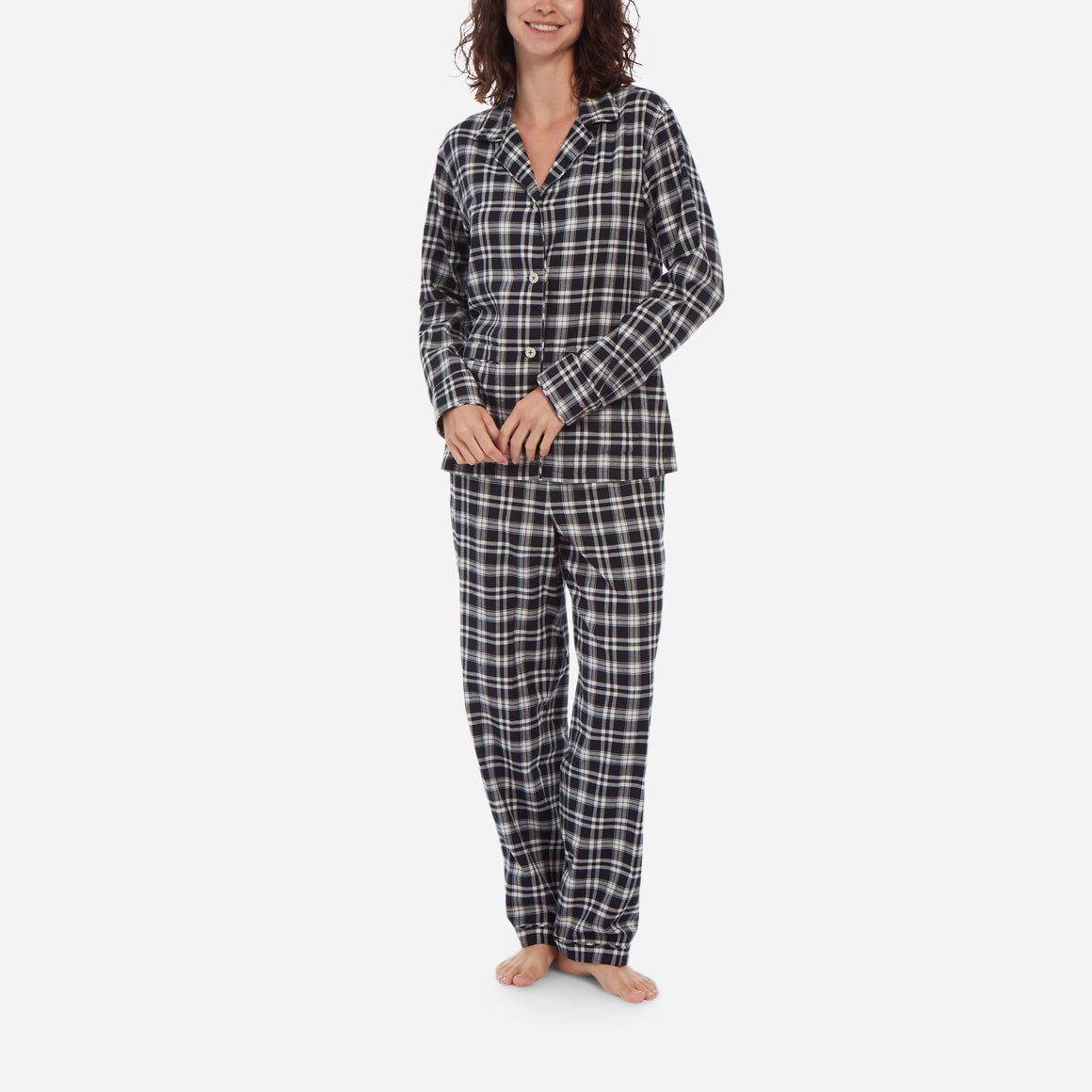 Female model image wearing black and white plaid flannel long sleeve pajama set.
