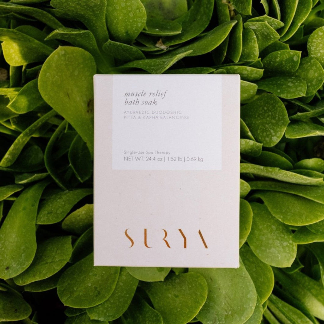 Surya muscle relief bath soak packaging on a green leafy background