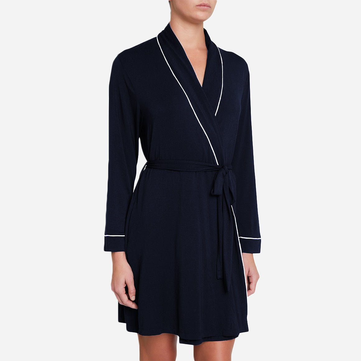 The Gisele Robe features a classic silhouette with a flattering knee-length cut, making it suitable for lounging at home or for a relaxed yet chic look when entertaining guests. The self-tie belt allows you to adjust the fit to your preference, while the wide lapel collar adds a touch of elegance.