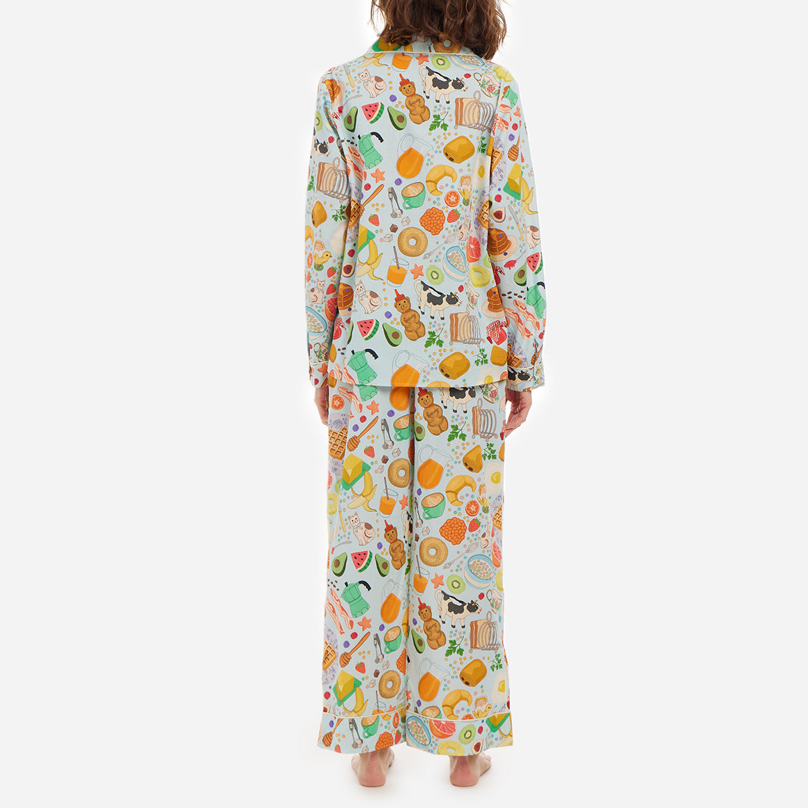 These pajamas feature a tailored fit with long sleeves, making them perfect for cool evenings and mornings spent lounging. The high-quality, soft and breathable cotton fabric feels gentle against your skin and the intricate details and beautiful finishings showcase Karen Mabon’s attention to detail.