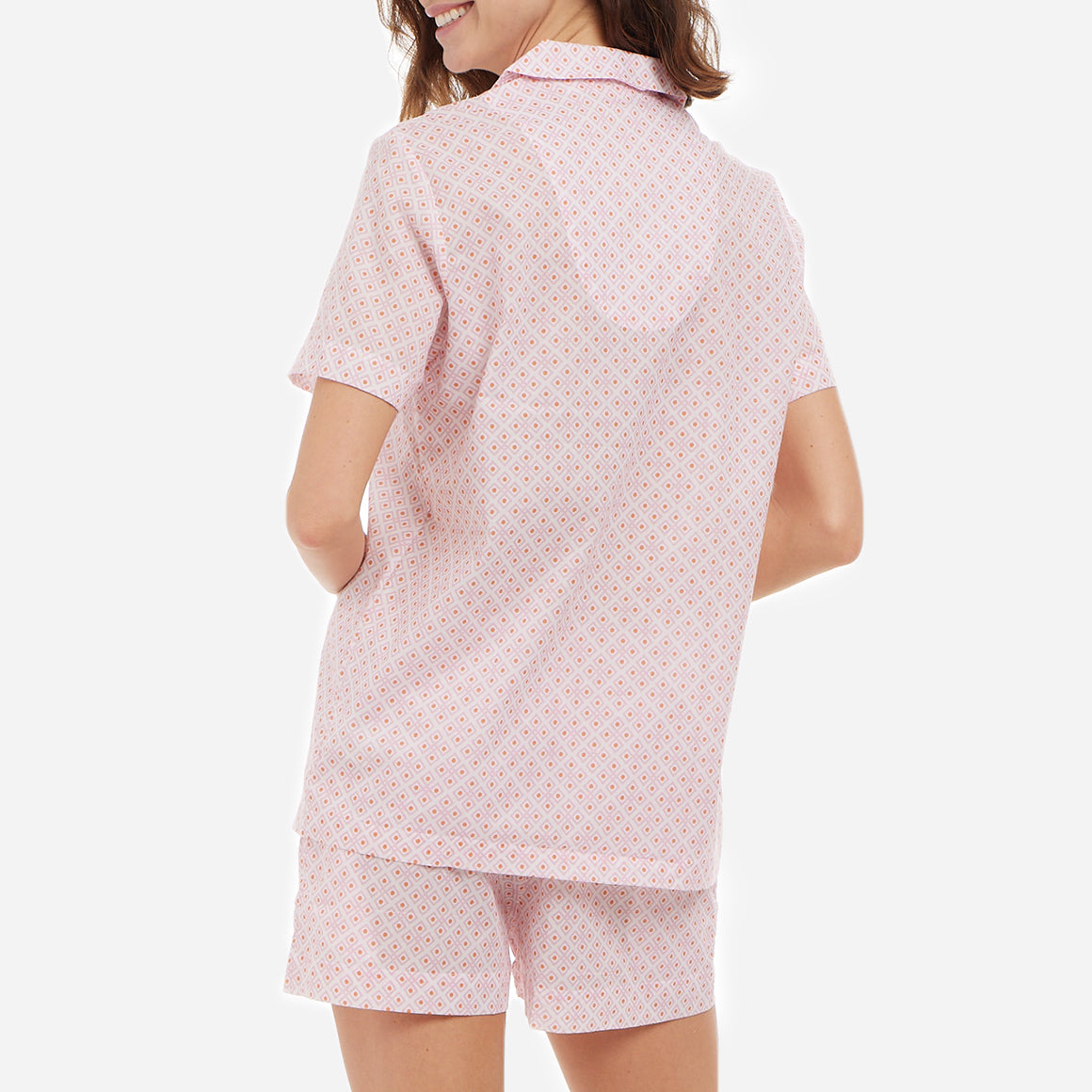 The short sleeves of this pajama set offer a breezy feel, perfect for warm summer nights or year-round comfort, while the elastic waistband on the shorts provides a custom fit. The relaxed cut allows for ease of movement, ensuring you stay comfortable and unrestricted as you unwind or go about your morning routine.