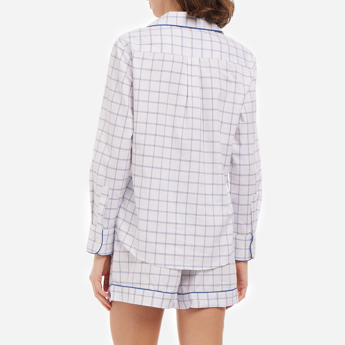 This classic tattersall check set is made from breathable and soft brushed cotton that feels light and heavenly on your skin. The pajama shirt has a relaxed cut for unrestricted movement, while the shorts feature a comfy elastic waist for a custom fit.