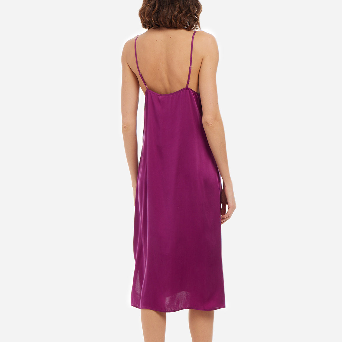 Crafted with meticulous attention to detail, this chemise is made from semi-sheer silk, which feels soft and gentle against your skin. The adjustable straps ensure a customized fit, while the v-neckline adds an elegant touch. The just below the knee length and airy drape allows for freedom of movement.