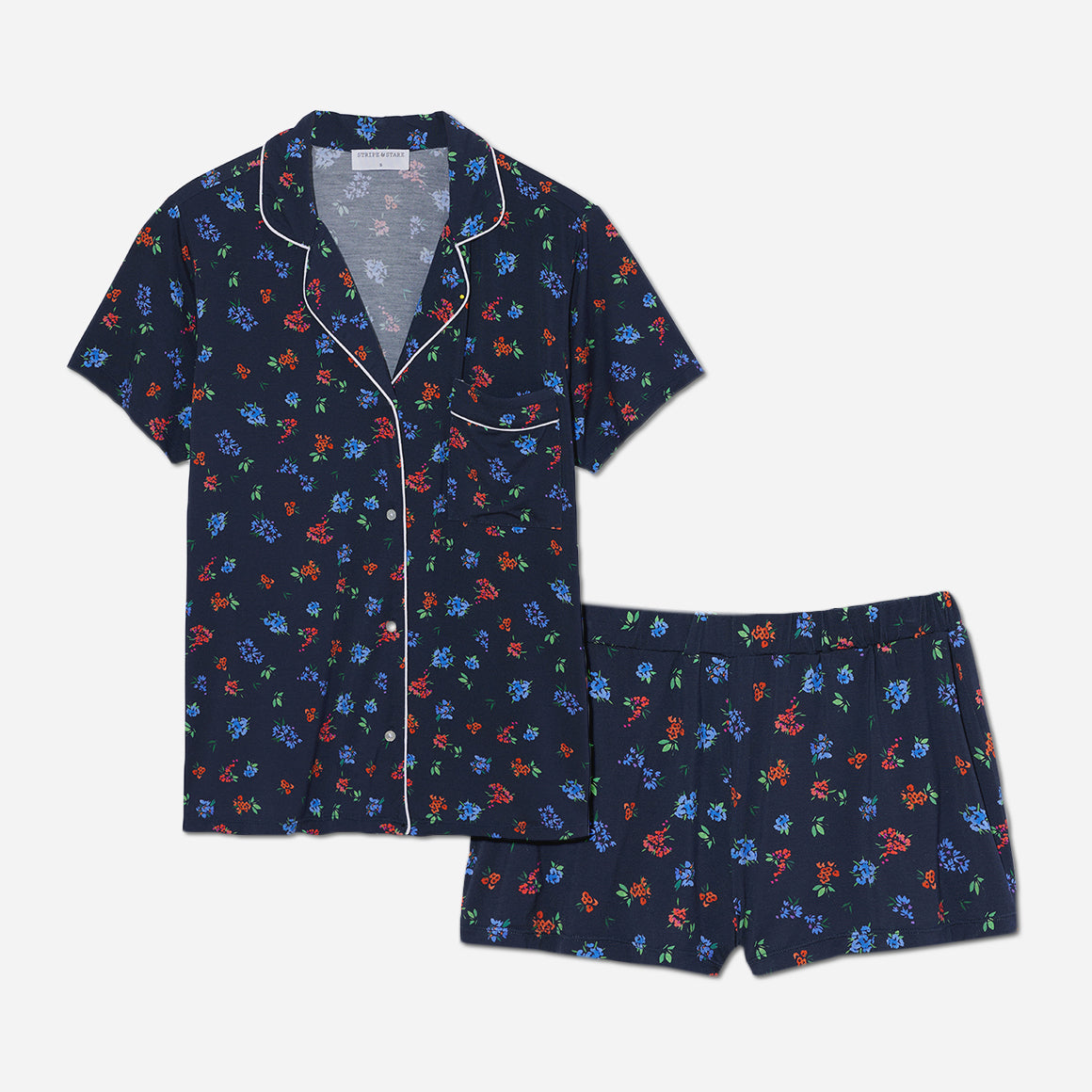 The timeless design of this short pajama set is accentuated by its tailored cut and refined detailing. The button-down front allows for easy wearing and effortless style, while the matching shorts feature an elastic waistband that provides a customized fit.