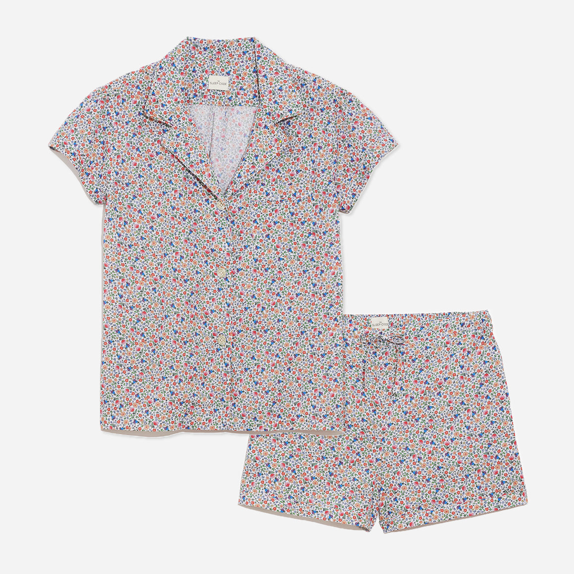 Our short sleeve pajama set features a relaxed fit, providing you with a comfortable and stylish option for warmer weather. The pajama set includes a classic button-up top with a collar, while the matching shorts feature a comfortable elastic waistband, drawstring, and side-seam pockets. The short sleeves offer extra breathability and coverage for warmer evenings.