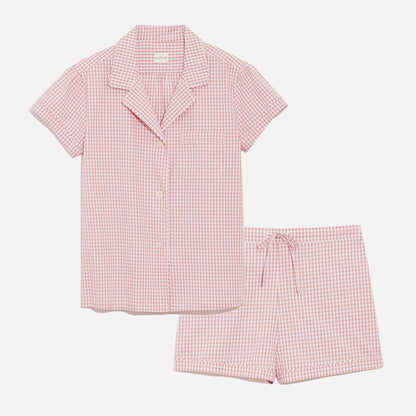 Our short sleeve pajama set features a relaxed fit, and includes a classic button-up top with a camp collar and chest pocket. The matching shorts feature an elastic waistband and drawstring for a custom fit, and convenient side-seam pockets.