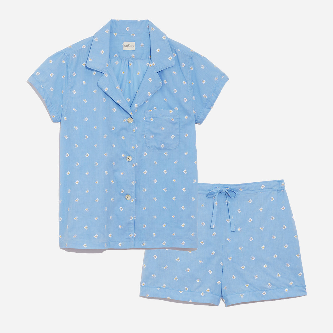 Our short sleeve pajama set features a relaxed fit. It includes a classic button-up top with a collar, while the matching shorts feature a comfortable elastic waistband, drawstring, and side-seam pockets.