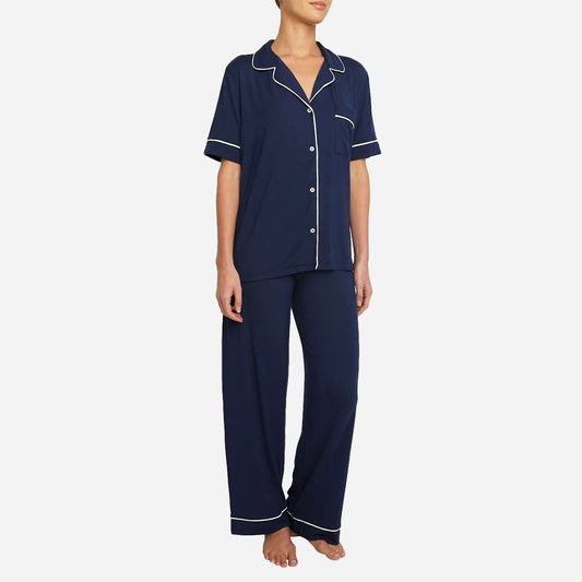 The classic yet contemporary silhouette flatters all body types, and its relaxed fit allows for unrestricted movement and maximum comfort, ensuring you wake up feeling refreshed and rejuvenated. The button-down top exudes sophistication, while the notched collar adds a touch of refinement. The matching low-rise straight leg pants offer a modern and flattering look, while the elastic waistband provides a customized fit.