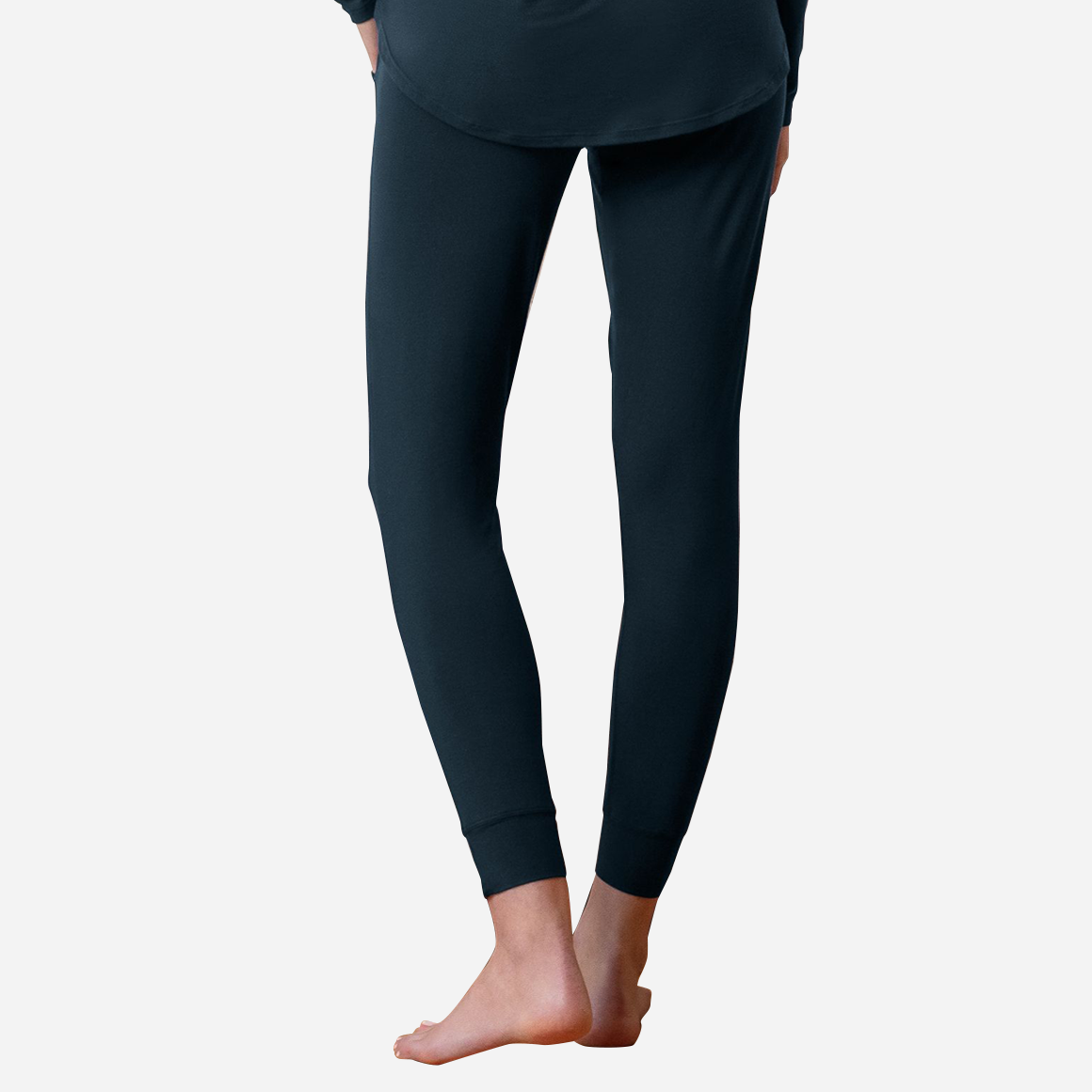 Dark Blue lounge and sleep pant on rear-facing model slim fitting and tapered legs with elasticated ankle cuff. 
