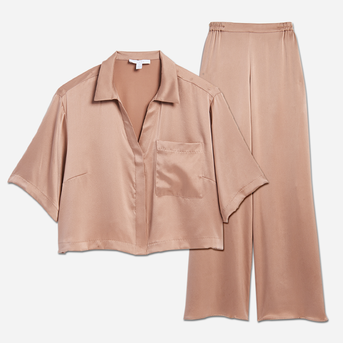 The high-waisted pants have pockets at the hip and side slits at the ankles for added ventilation. The matching short sleeve top is cropped at the waist, has a flattering v-neckline, and chest pocket. The lightweight and breathable fabric makes it perfect for lounging or sleeping, while the elegant design adds a touch of sophistication to your sleepwear collection.