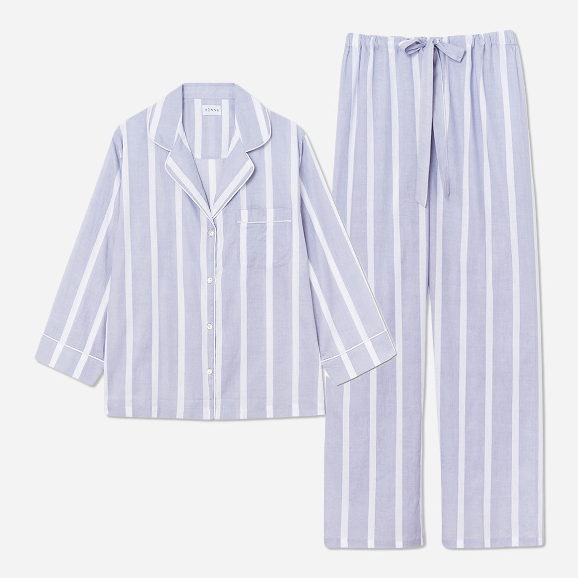 This striped set is made from breathable and soft GOTS-certified organic cotton voile that feels light and airy on your skin. The pajama shirt has a boxy fit for unrestricted movement, while the straight leg pants feature a comfy elastic waist for a custom fit that can be worn high on the waist or low on the hips.