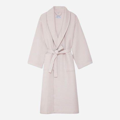 This bathrobe features a relaxed fit with a detachable belt and pockets for added convenience. The cozy waffled fabric is designed to maximize the absorption of water to keep you dry and warm as you unwind or go about your morning routine.