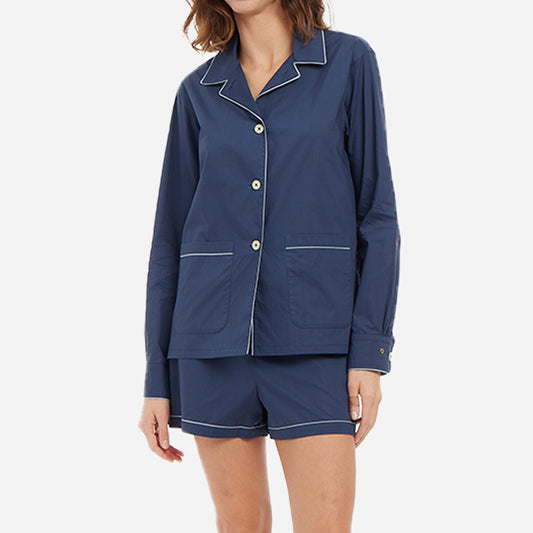 Dark blue long sleeve button-up top with matching shorts on female model. 