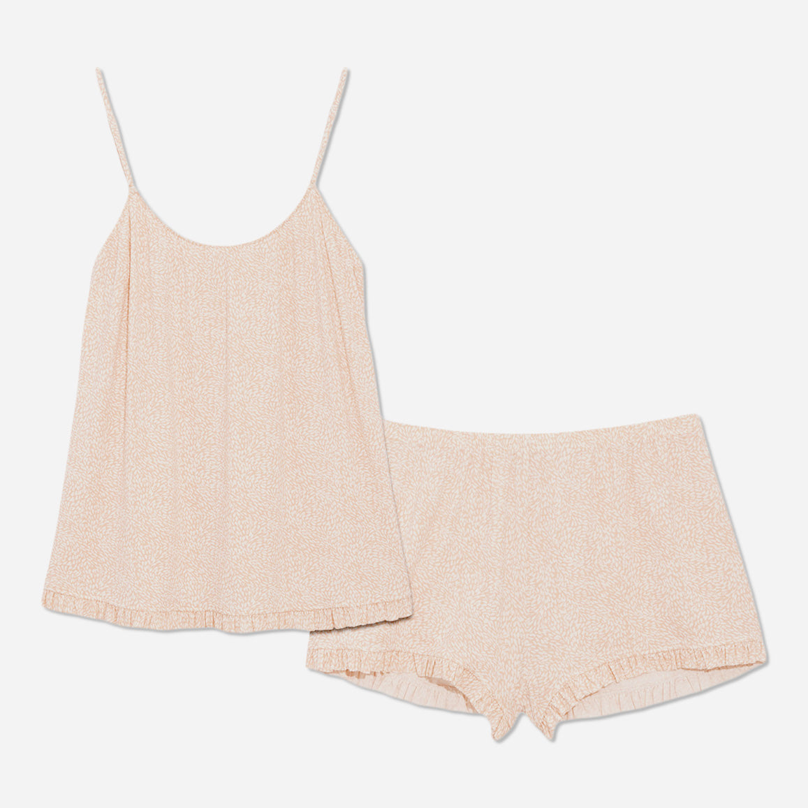 The cami top features delicate adjustable straps and a flattering neckline that accentuates your natural beauty. The accompanying shorts are designed with both style and comfort in mind. The relaxed fit allows for effortless movement, while the elastic waistband ensures a secure and personalized fit. 