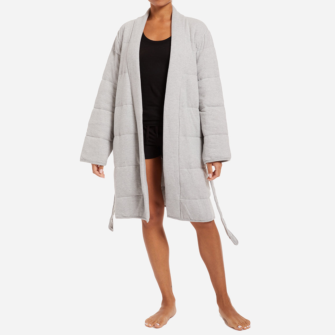 This robe is a stylish and functional addition to your loungewear collection. The peachy jersey material combined with all-over horizontal quilted panels and a defining waist tie provides ultimate warmth and comfort. The robe features convenient patch pockets and a shawl collar, adding an extra touch of elegance to the design.