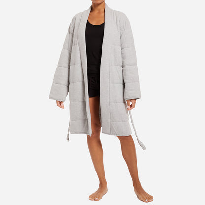 This robe is a stylish and functional addition to your loungewear collection. The peachy jersey material combined with all-over horizontal quilted panels and a defining waist tie provides ultimate warmth and comfort. The robe features convenient patch pockets and a shawl collar, adding an extra touch of elegance to the design.