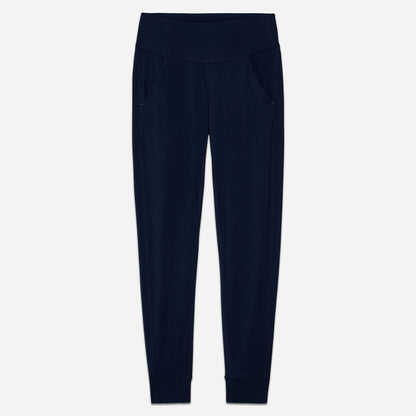 Dagsmejan’s Balance Sleep Pants in dark blue with a jogger fit laying flat on a grey background.