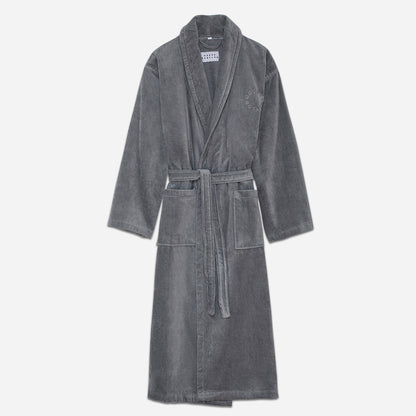 This bathrobe features a relaxed fit with a detachable belt and pockets for added convenience. The cozy velour fabric is designed to maximize the absorption of water to keep you dry and warm as you unwind or go about your morning routine.