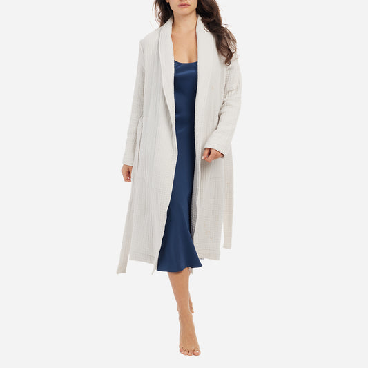 The Zoey Robe features a relaxed fit with a detachable belt and pockets for added convenience. The breathable cotton gauze fibers are designed to keep you cool and cozy as you unwind or go about your bedtime routine.