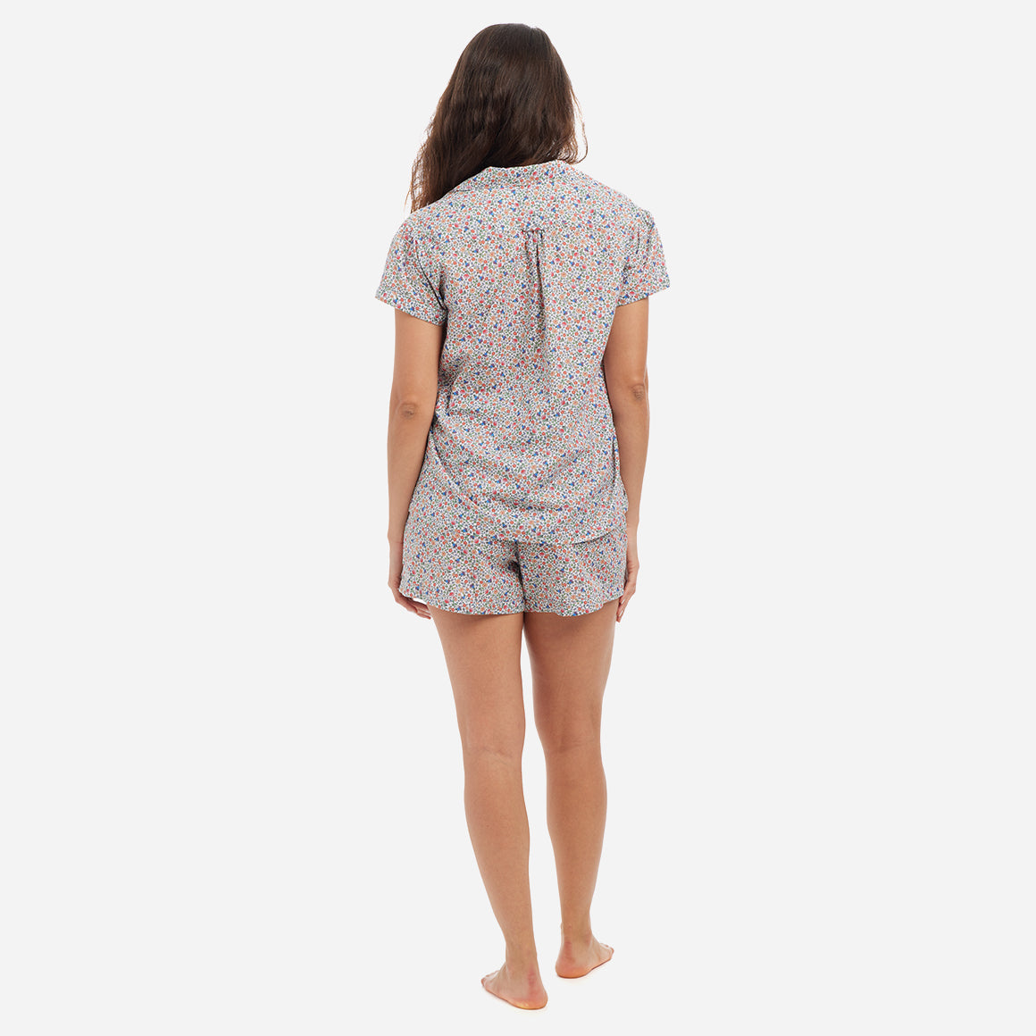 Our short sleeve pajama set features a relaxed fit, providing you with a comfortable and stylish option for warmer weather. The pajama set includes a classic button-up top with a collar, while the matching shorts feature a comfortable elastic waistband, drawstring, and side-seam pockets. The short sleeves offer extra breathability and coverage for warmer evenings.