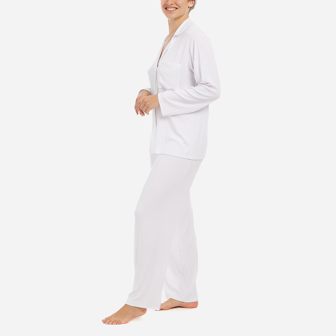 The classic yet contemporary silhouette flatters all body types, and its relaxed fit allows for unrestricted movement and maximum comfort, ensuring you wake up feeling refreshed and rejuvenated. The button-down top exudes sophistication, while the notched collar adds a touch of refinement. The matching low-rise straight leg pants offer a modern and flattering look, while the elastic waistband provides a customized fit.