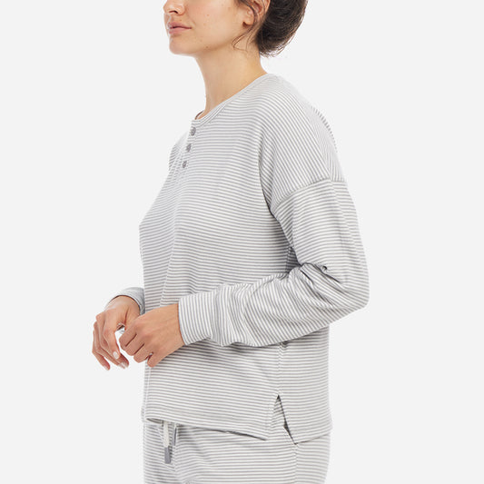 This cozy top features a relaxed fit, drop shoulders and flattering neckline. Detailed with a classic yarn-dyed stripe, this stylish lounge shirt is a wind-down must have.