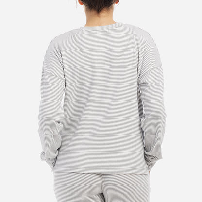 This cozy top features a relaxed fit, drop shoulders and flattering neckline. Detailed with a classic yarn-dyed stripe, this stylish lounge shirt is a wind-down must have.