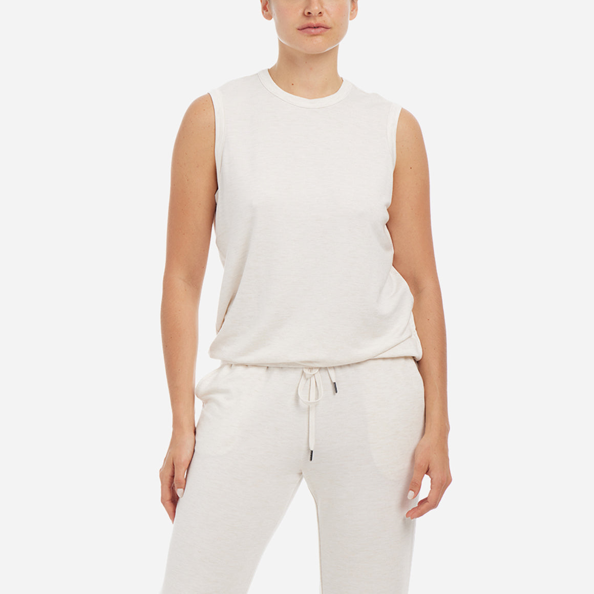 This cozy tank features a relaxed fit with a high neckline and a banded hem for a secure fit. To complete the look, pair with the Essential Lounge Pants.