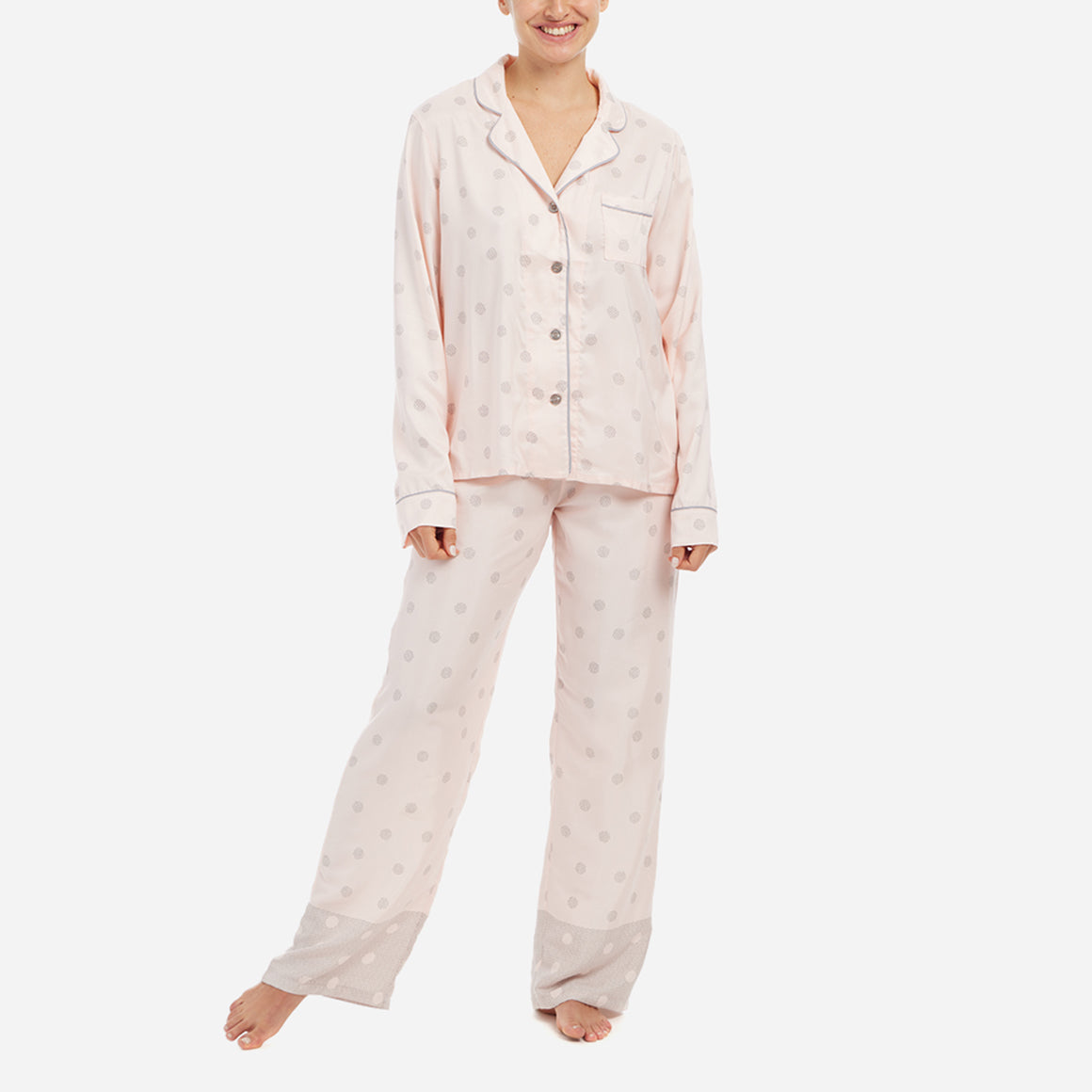 The classic yet contemporary silhouette flatters all body types, and its relaxed fit allows for unrestricted movement and maximum comfort, ensuring you wake up feeling refreshed and rejuvenated. The button-down top exudes sophistication, while the notched collar adds a touch of refinement. The matching straight leg pants offer a modern and flattering look, while the elastic waistband provides a customized fit.