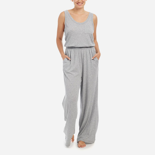 Front facing model wearing a heather grey scoop neck jumpsuit.