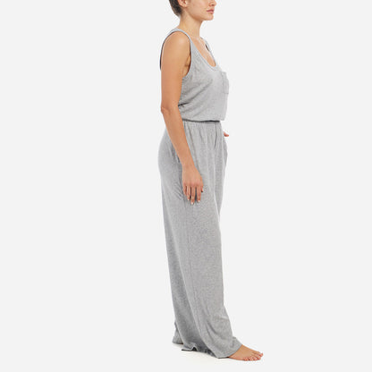 Side facing model wearing a relaxed heather grey jumpsuit.