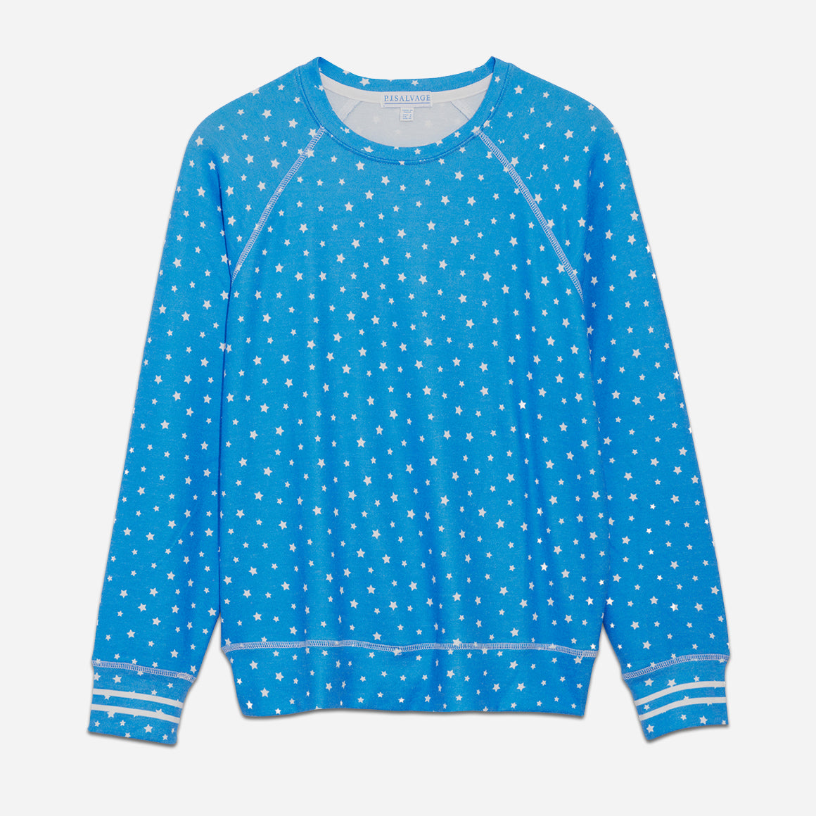 This jersey long sleeve top features a cozy fit and a flattering raglan sleeve. Detailed with a cheerful star print and double stripes on the ribbed cuffs, this stylish lounge top is a wind-down must have. Complete the look with the Star Jogger.