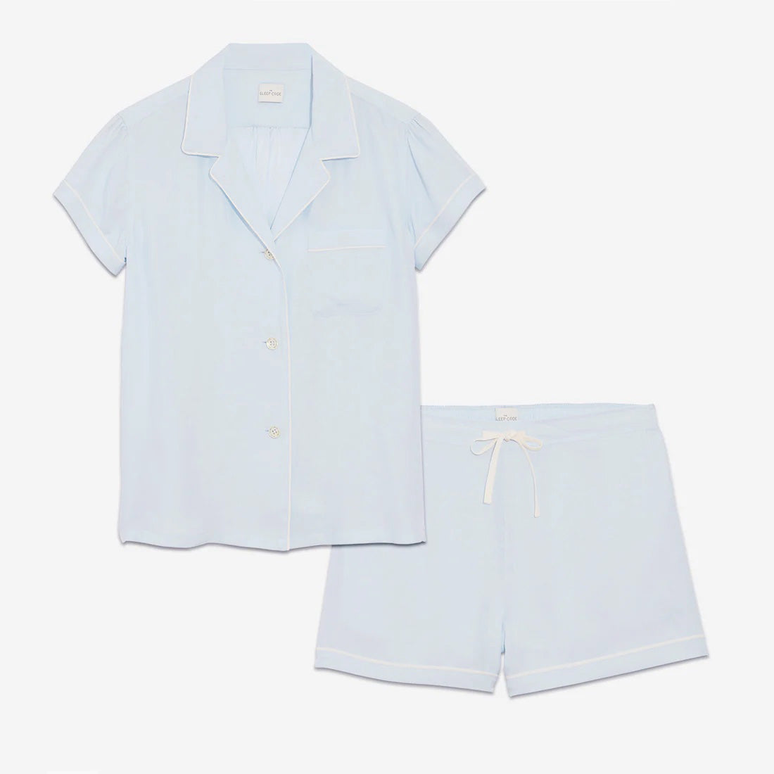 Our short sleeve pajama set features a relaxed fit, providing you with a comfortable and stylish option for warmer weather. The pajama set includes a classic button-up top with a collar, while the matching shorts feature a comfortable elastic waistband, drawstring, and side-seam pockets.