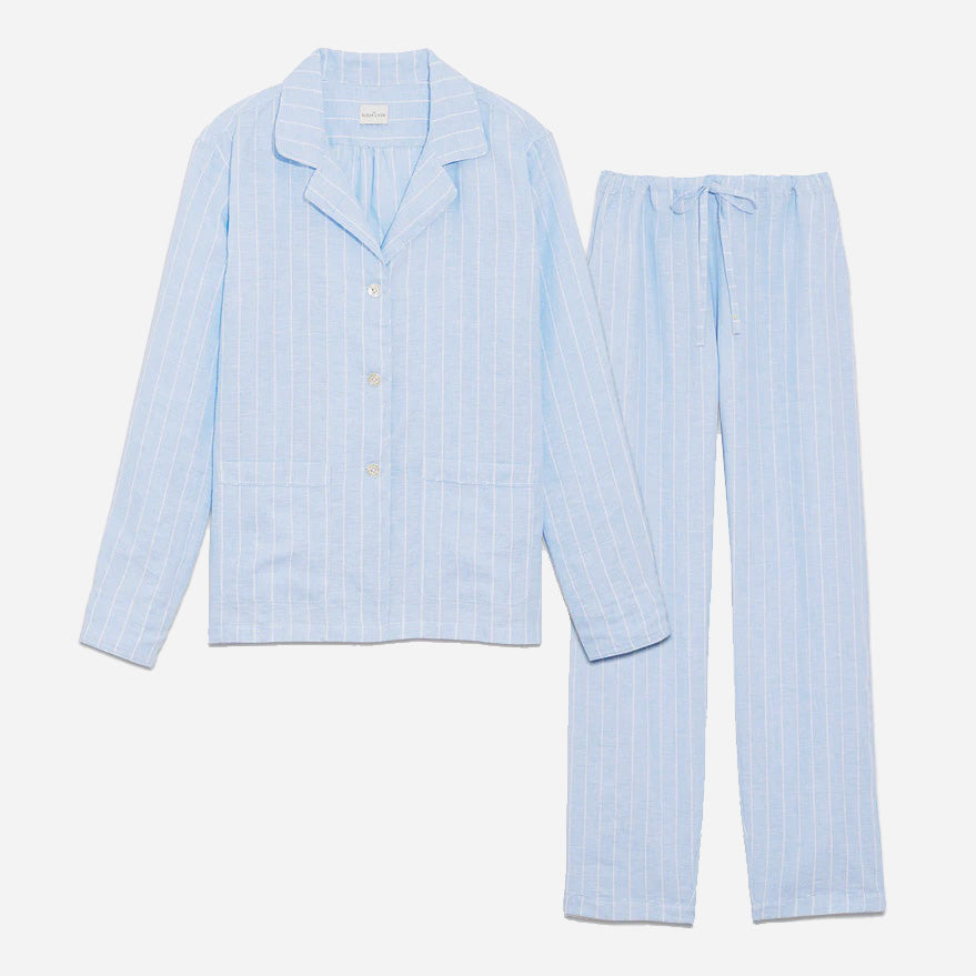 Our long sleeve pajamas feature a relaxed fit, providing a comfortable and stylish option for your bedtime routine. The pajama set includes a classic button-up top with a collar, two patch pockets, and functional button cuffs. The matching pair of pants features a comfortable elastic waistband, drawstring, and side-seam pockets. This cozy pj set is a timeless and stylish look that is perfect for lounging at home.