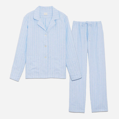 Our long sleeve pajamas feature a relaxed fit, providing a comfortable and stylish option for your bedtime routine. The pajama set includes a classic button-up top with a collar, two patch pockets, and functional button cuffs. The matching pair of pants features a comfortable elastic waistband, drawstring, and side-seam pockets. This cozy pj set is a timeless and stylish look that is perfect for lounging at home.